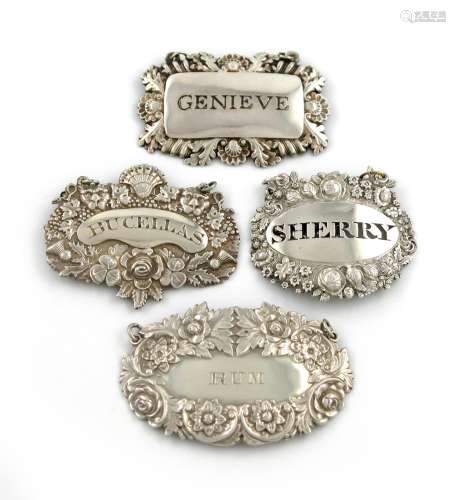 A collection of four early 19th century silver wine labels, various dates and makers, foliate, shell