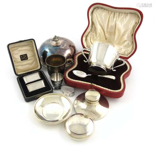 A mixed lot of silver items, comprising: a silver-gilt mug, London 1894, a cased christening bowl