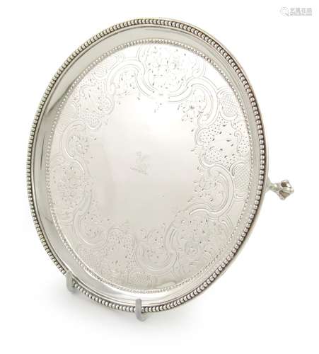 A George III silver waiter, by Robert Jones, London 1781, circular form, beaded borders, the