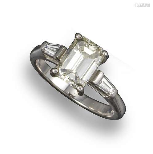 A diamond solitaire ring, the emerald-cut diamond weighs approximately 1.80cts in total, flanked