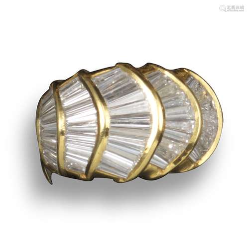 A diamond bombe ring, set with five sections of tapered baguette-shaped diamonds in yellow gold