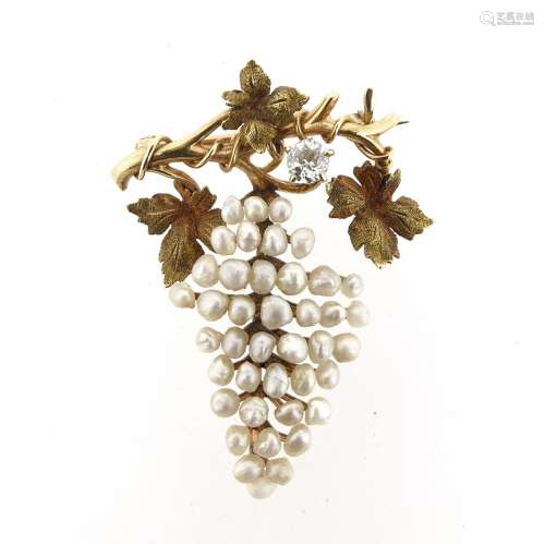 A fruiting vine brooch, the grapes formed as seed pearls and set with a diamond to the textured