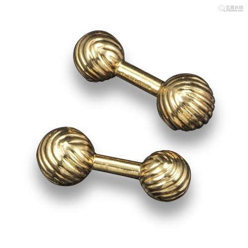 A pair of gold cufflinks by Tiffany & Co, each spherical terminal with fluted decoration in yellow
