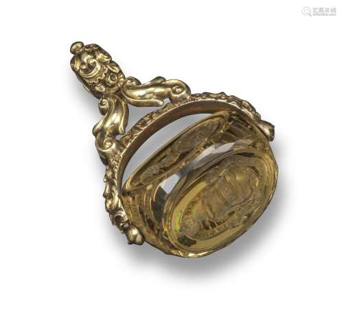 A Regency gold fob seal, set with a swivel citrine fob seal, carved with coat of arms, 4.4cm long