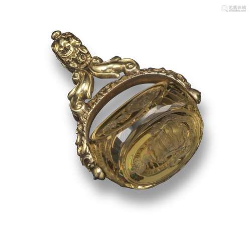 A Regency gold fob seal, set with a swivel citrine fob seal, carved with coat of arms, 4.4cm long