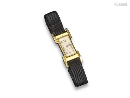 CARTIER - a lady's gold wristwatch, the rectangular cream dial signed Cartier with Roman numerals,