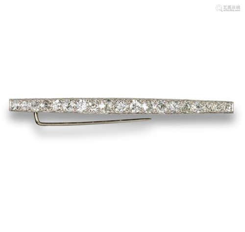 A diamond-set bar brooch, the slightly graduated old circular and cushion-shaped diamonds set in