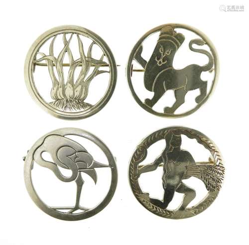 Four animal and zodiac brooches by H.G. Murphy, the circular silver brooches depicting a lion