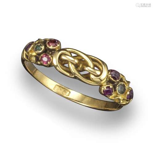 A gold knot ring, the shoulders set with small green and red stones, size O