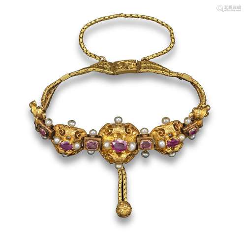 A 19th century French ruby and pearl-mounted gold bracelet, the three engraved and pierced open-work