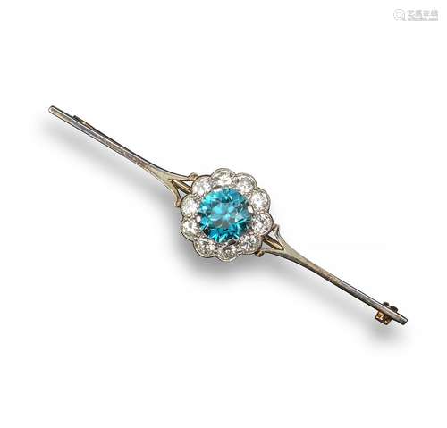 An early 20th century diamond and zircon cluster brooch, the circular-cut zircon set within a