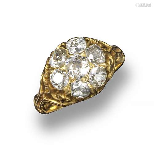 A late Victorian diamond cluster ring, the seven old circular-cut diamonds are set in yellow gold