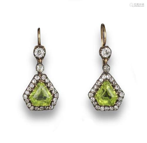 A pair of late Victorian peridot and diamond drop earrings, the calf's head-shaped peridots are