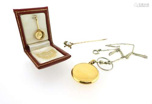 A gold pan-form pendant by Cartier, engraved 'Luigi', signed Cartier London to the reverse, 2.5cm
