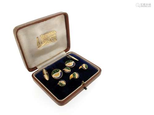 A pair of polychrome enamel cufflinks, of abstract design an decorated with guilloche enamel, with