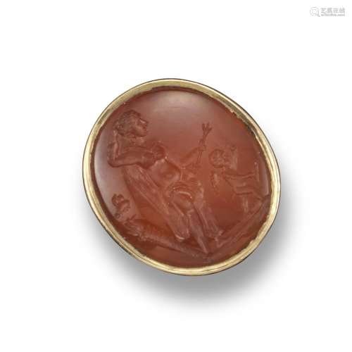A 19th century carved carnelian intaglio ring, depicting a standing female figure with cupid and a