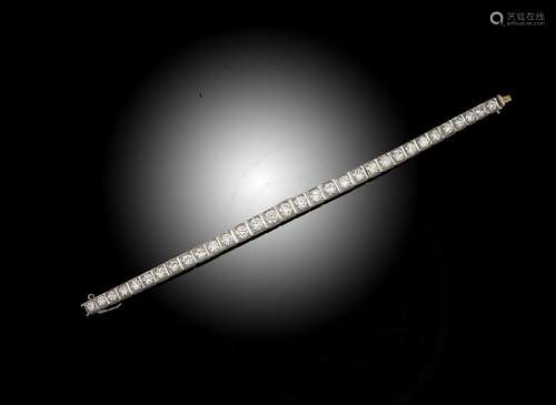 A diamond line bracelet, the thirty two graduated round brilliant-cut diamonds weigh approximately