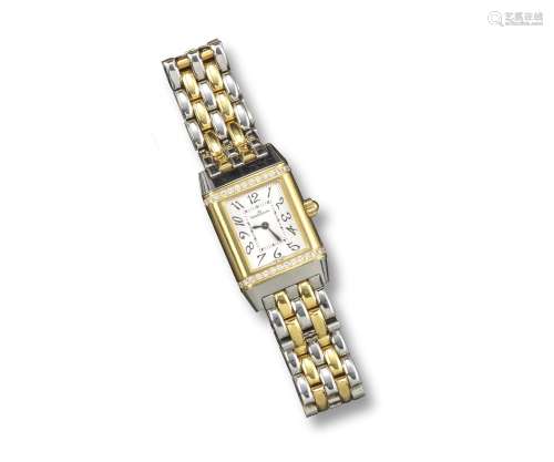 JAEGER LECOULTRE - a lady's gold and steel reverso wristwatch, the signed dial with guilloche