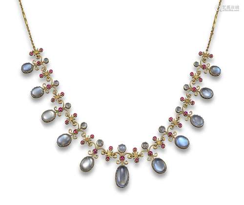 An early 20th century moonstone and ruby fringe necklace, set with a line of graduated oval