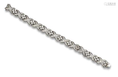 A diamond-set white gold bracelet, set with quatrefoils of round brilliant-cut diamonds and joined