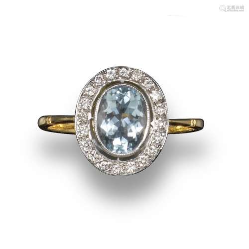 An aquamarine and diamond cluster ring, the oval-shaped aquamarine weighs approximately 1.10cts