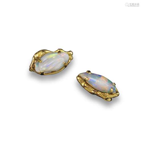A pair of carved abstract opal cufflinks, set in textured yellow gold, maker's mark JMW and London