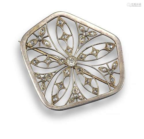 An Edwardian diamond-set brooch, of pierced flower head design set with diamonds on knife-edge