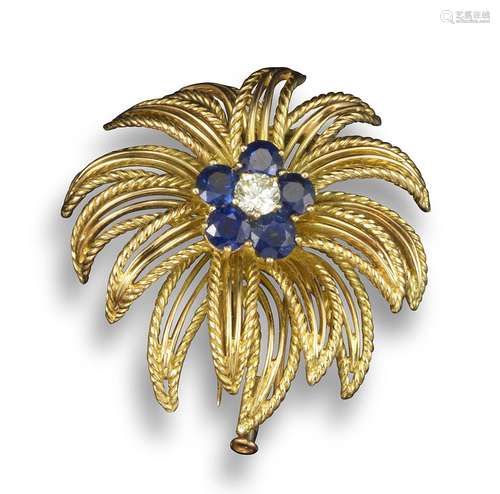 A sapphire and diamond-set yellow gold floral brooch by Boucheron, centred with a round brilliant-