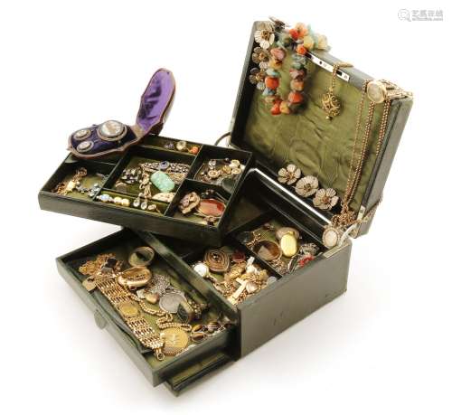 A jewellery casket containing a quantity of jewellery including a gold gate-link bracelet set with a