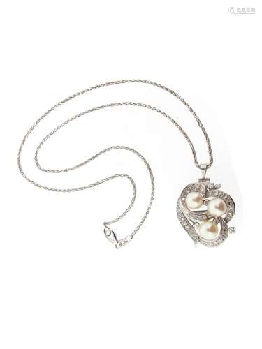 A cultured pearl and diamond pendant, the three cultured pearls are set within scroll border of