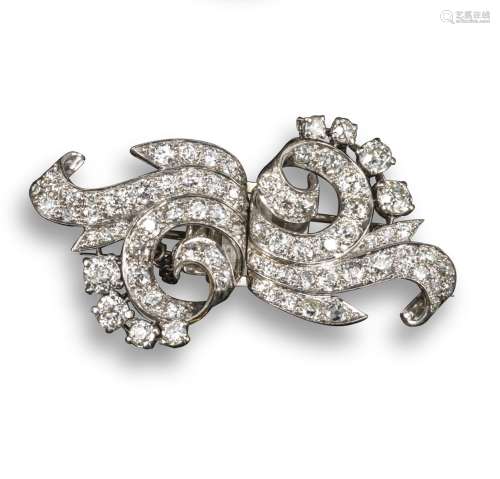 A 1950s diamond-set double clip scroll brooch, set overall with graduated circular-cut diamonds in