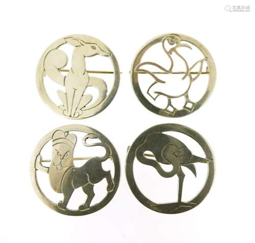 Four silver animal brooches by H. G. Murphy, the circular silver brooches depicting a flamingo; with