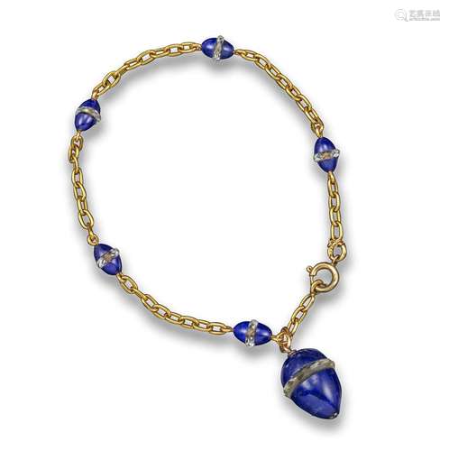 An early 20th century Russian yellow gold and lapis lazuli bracelet, the plain yellow gold oval