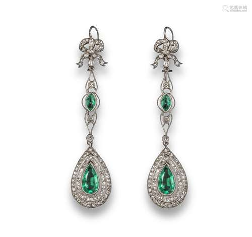 A pair of Edwardian emerald and diamond drop earrings, the pear-shaped emeralds are set within