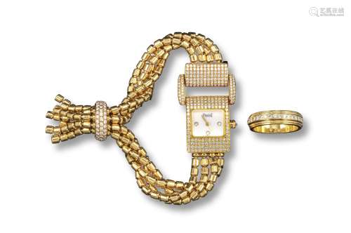 PIAGET - A lady's yellow gold wristwatch, the signed rectangular dial set with three diamonds,
