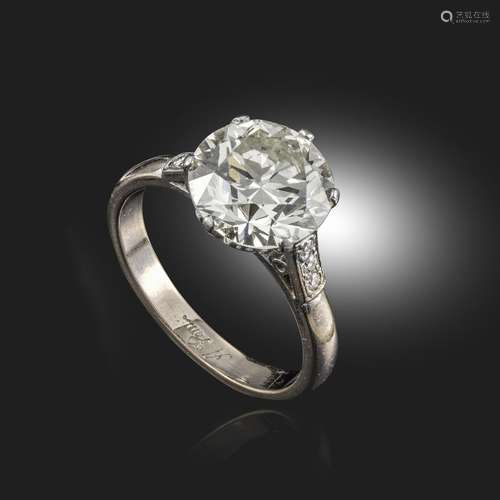 A diamond solitaire ring, the round brilliant-cut diamond weighs approximately 3.69cts, with three