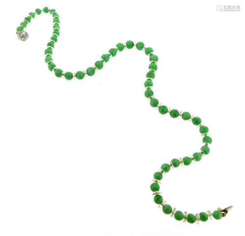 A single-row choker length jade bead necklace, each jade bead separated with a rock crystal rondel