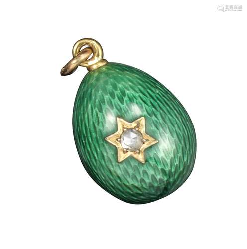 A green enamel egg pendant by Fabergй, workmaster August Hollming, decorated overall with green