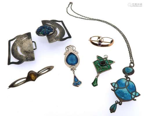 A small collection of Arts & Crafts jewellery, including a silver pierced buckle centred with a rose