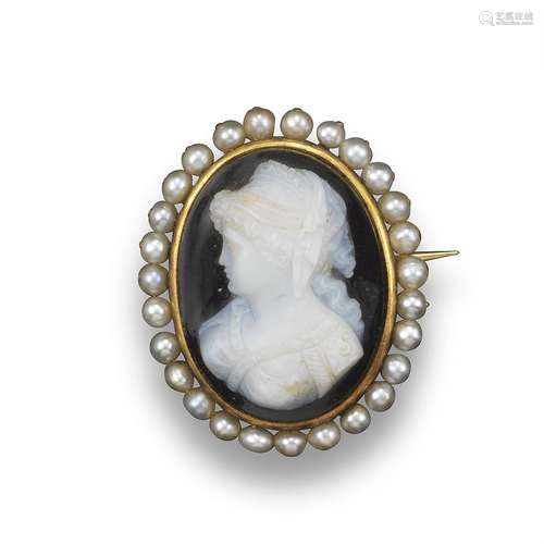 A carved hardstone cameo brooch, depicting a lady in classical dress and wearing a headdress, seed