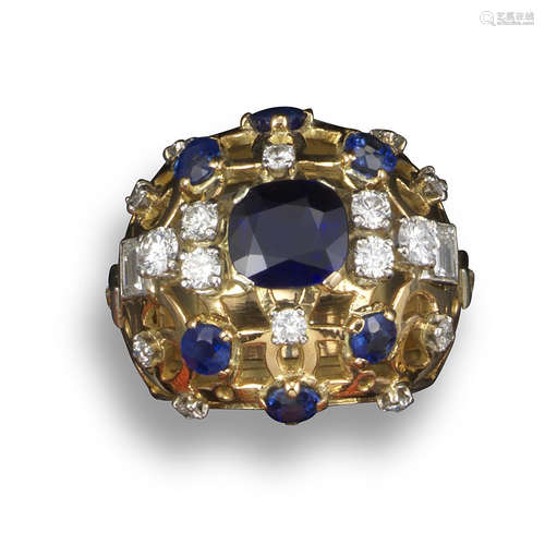 A sapphire and diamond-set pierced gold bombé ring, centred with a cushion-shaped sapphire with