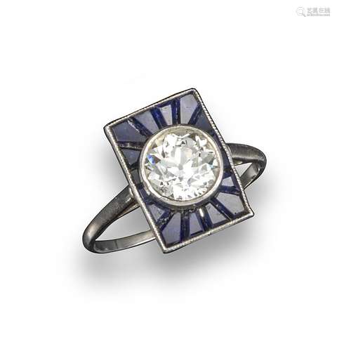 An Art Deco diamond and sapphire rectangular plaque ring, the old brilliant-cut diamond weighs