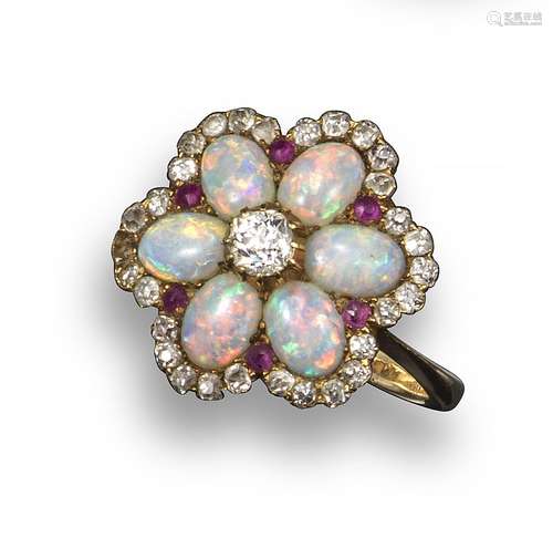 A diamond, opal and ruby-set cluster ring, of flower head form and centred with an old circular-