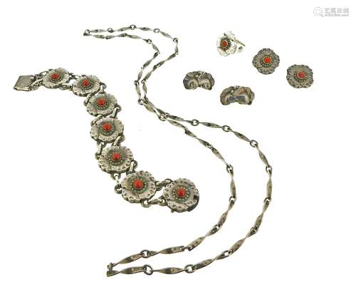 A suite of silver jewellery by Georg Jensen, designed as flower heads and centred with coral