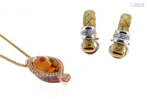 A cabochon citrine-set gold pendant, within a twisted yellow gold border set with diamonds, the