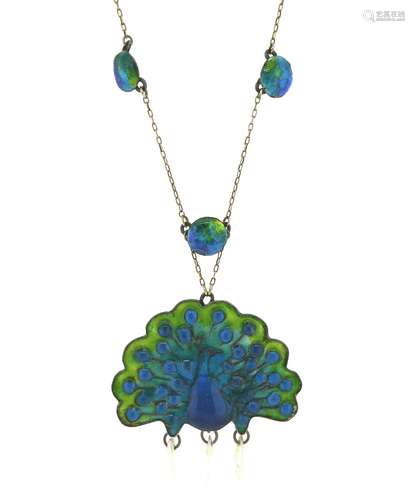 An Arts & Crafts silver and enamel peacock pendant, decorated with blue and green enamel and