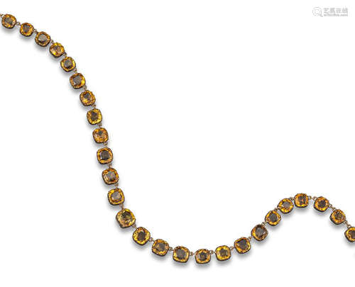 An early Victorian citrine-mounted rivière necklace, each cushion-shaped citrine set with a gold