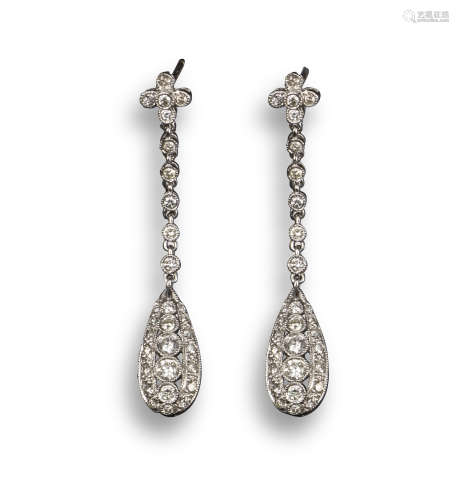 A pair of diamond drop earrings, the quatrefoil of diamonds suspends an articulated line of diamonds