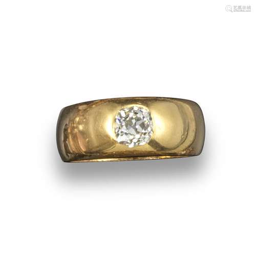 A diamond-set gold gypsy ring, the plain yellow gold band is set with an old cushion-shaped diamond,