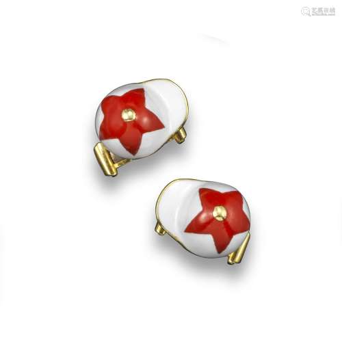 A pair of gold and enamel jockey cufflinks by Theo Fennell, the jockey's hats decorated with red and